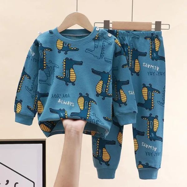 Pyjama bébé à motifs dinosaure bleu sur cintre