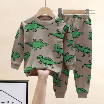Pyjama bébé à motifs dinosaures bleu sur cintre